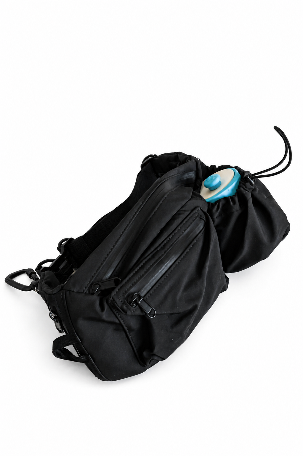 The Adventure Pouch 2.0 with a blue Sipper water bottle held in its stretch bottle holder